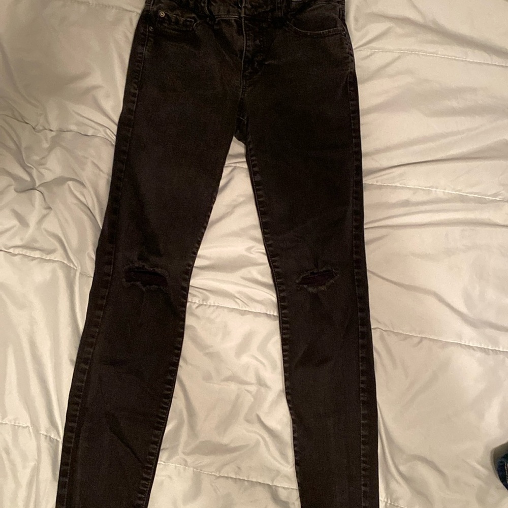 Jeans with holes in the knees. Lightly worn. Too small for me now